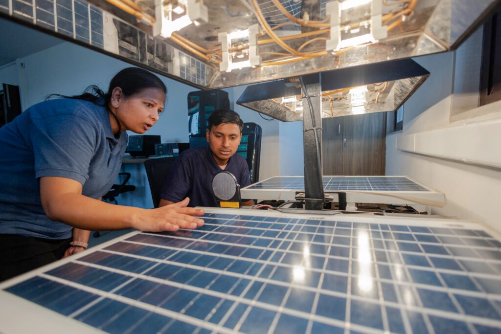 Students working on solar energy and smart infrastructure systems during practical technical training.